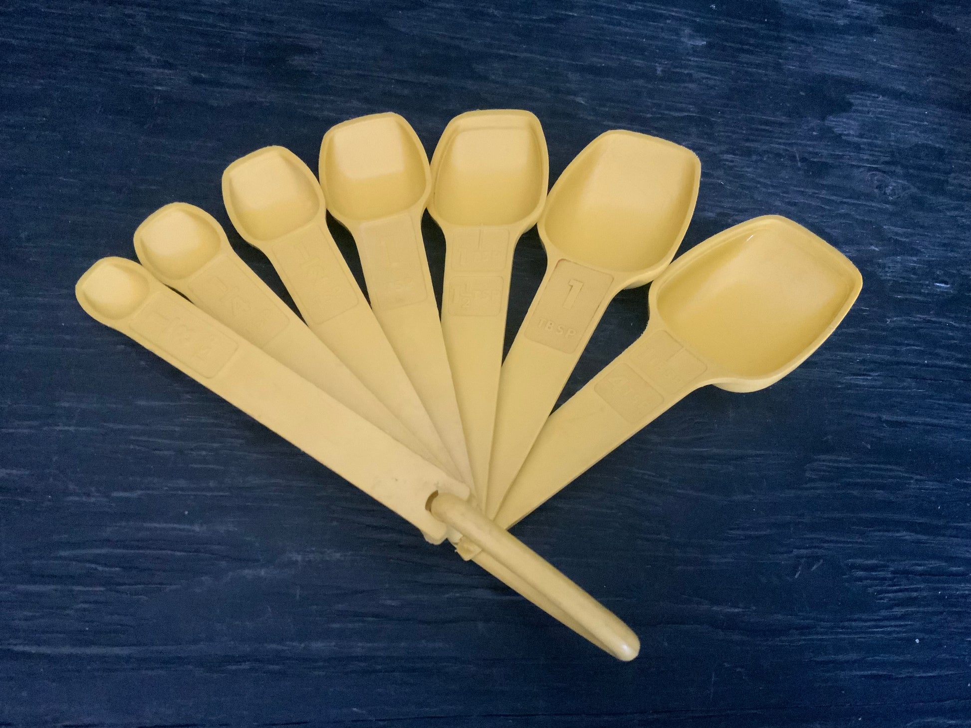 Yellow Tupperware Measuring Spoons