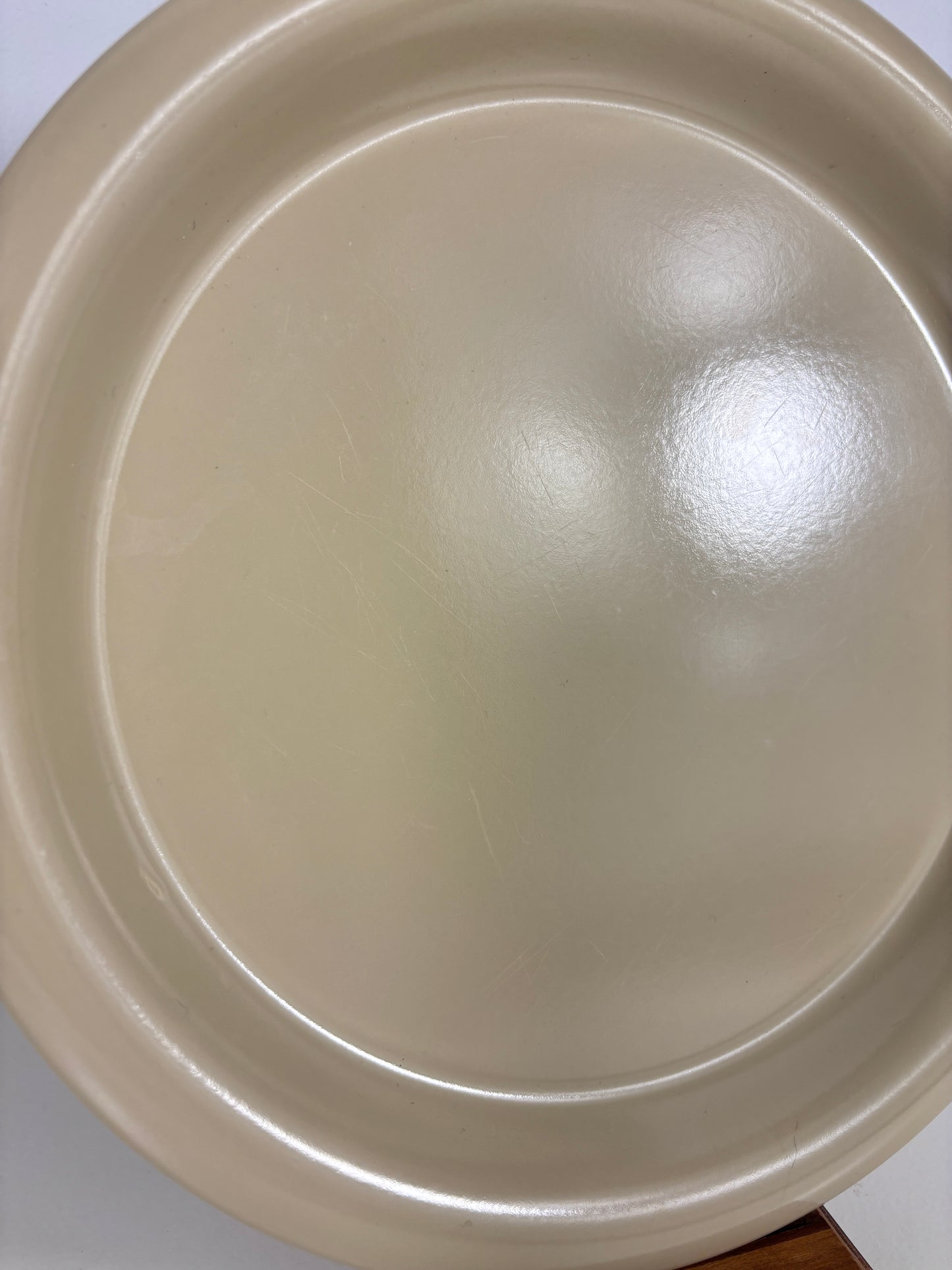 Beige plate on a white background