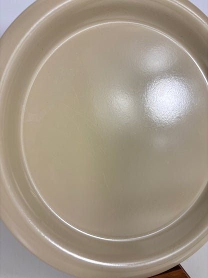 Beige plate on a white background