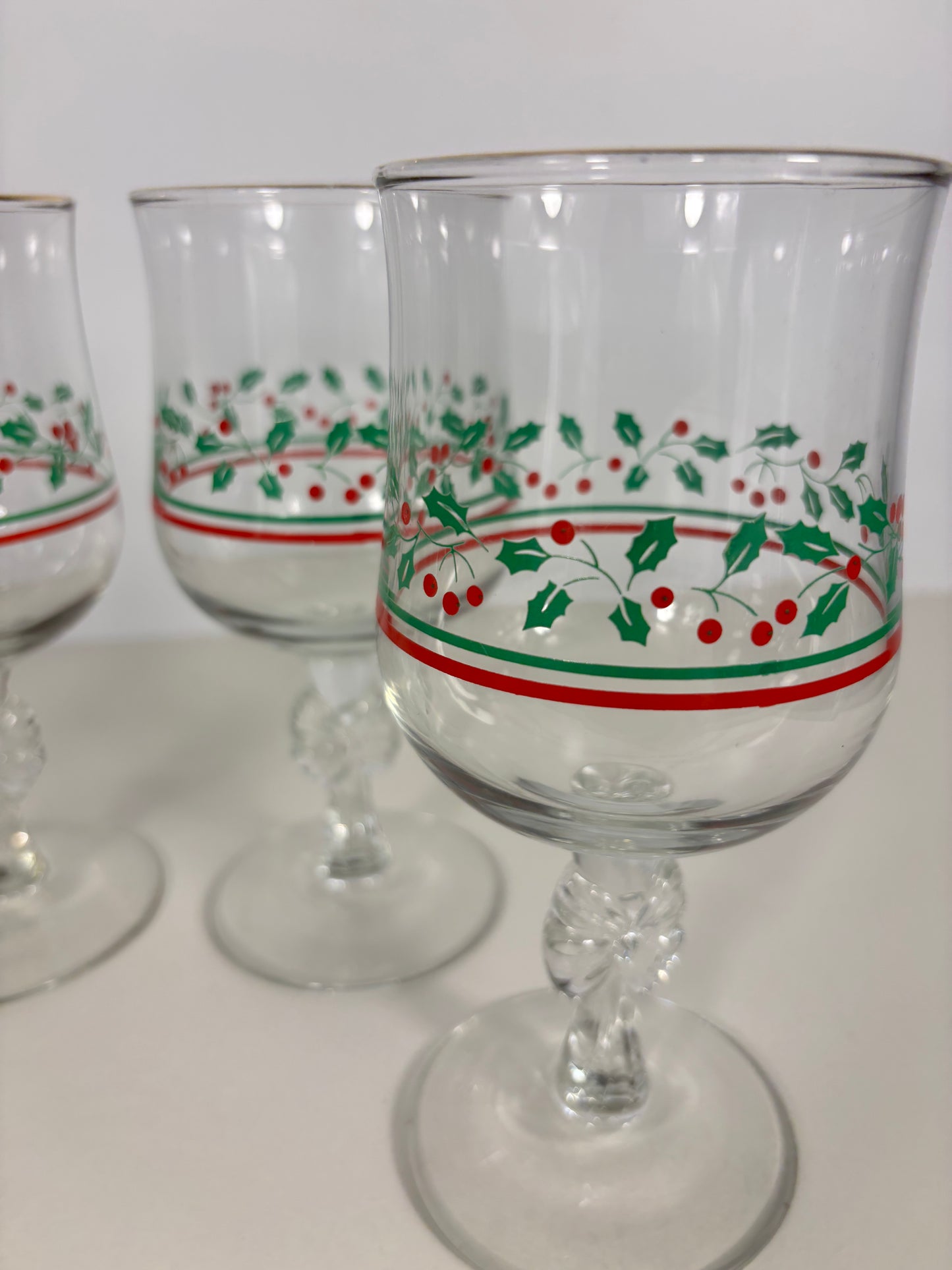 Clear glass with holly design on a white background