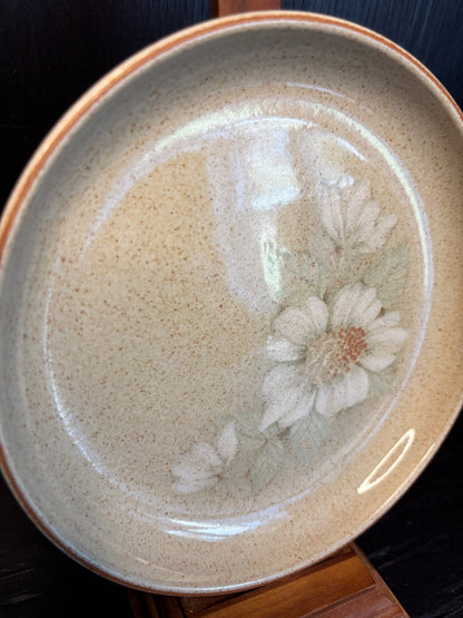 Denby Daybreak Bread Plate with a beige background and white flower motif