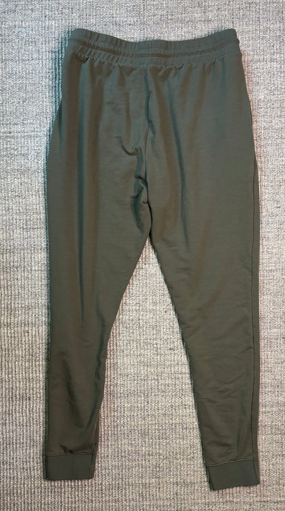 Green pants on a textured gray surface