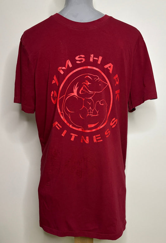 Red t-shirt with Gymshark Fitness logo on a mannequin against a white background