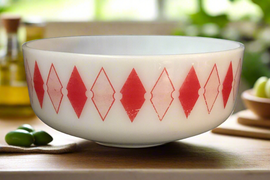 white bowl with red diamonds