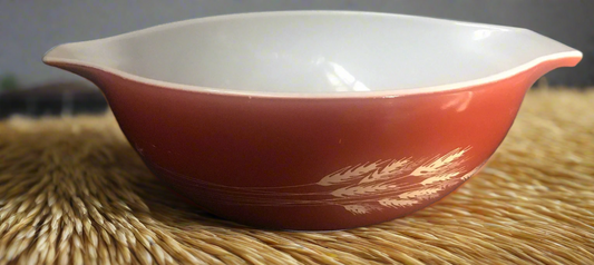 red Pyrex bowl with wheat graphics