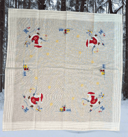 Quilt with Santa Claus design in a snowy outdoor setting