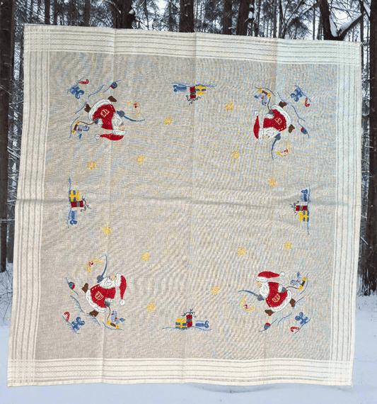 Quilt with Santa Claus design in a snowy outdoor setting