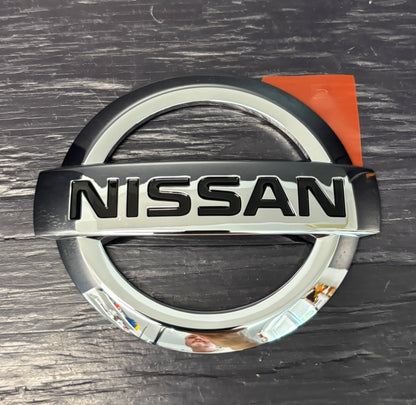 Nissan logo on a metallic background