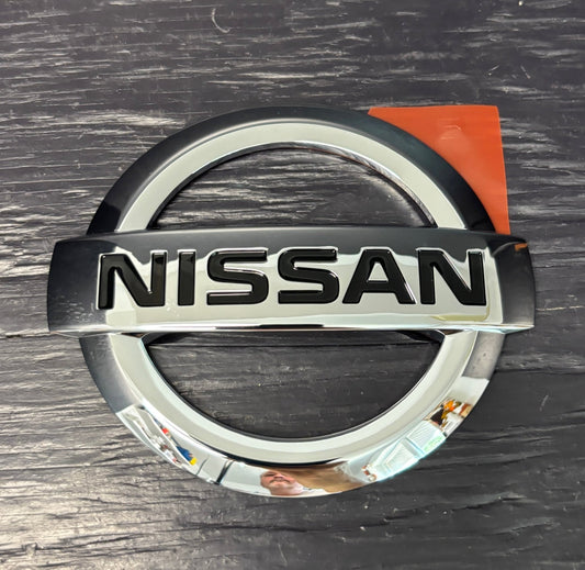 Nissan logo on a metallic background