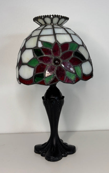 Tiffany-style lamp with stained glass shade on a white background