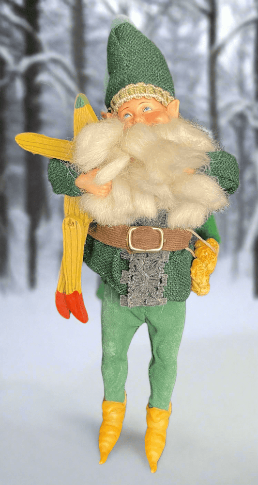 Elf figurine with a sword in a snowy forest setting