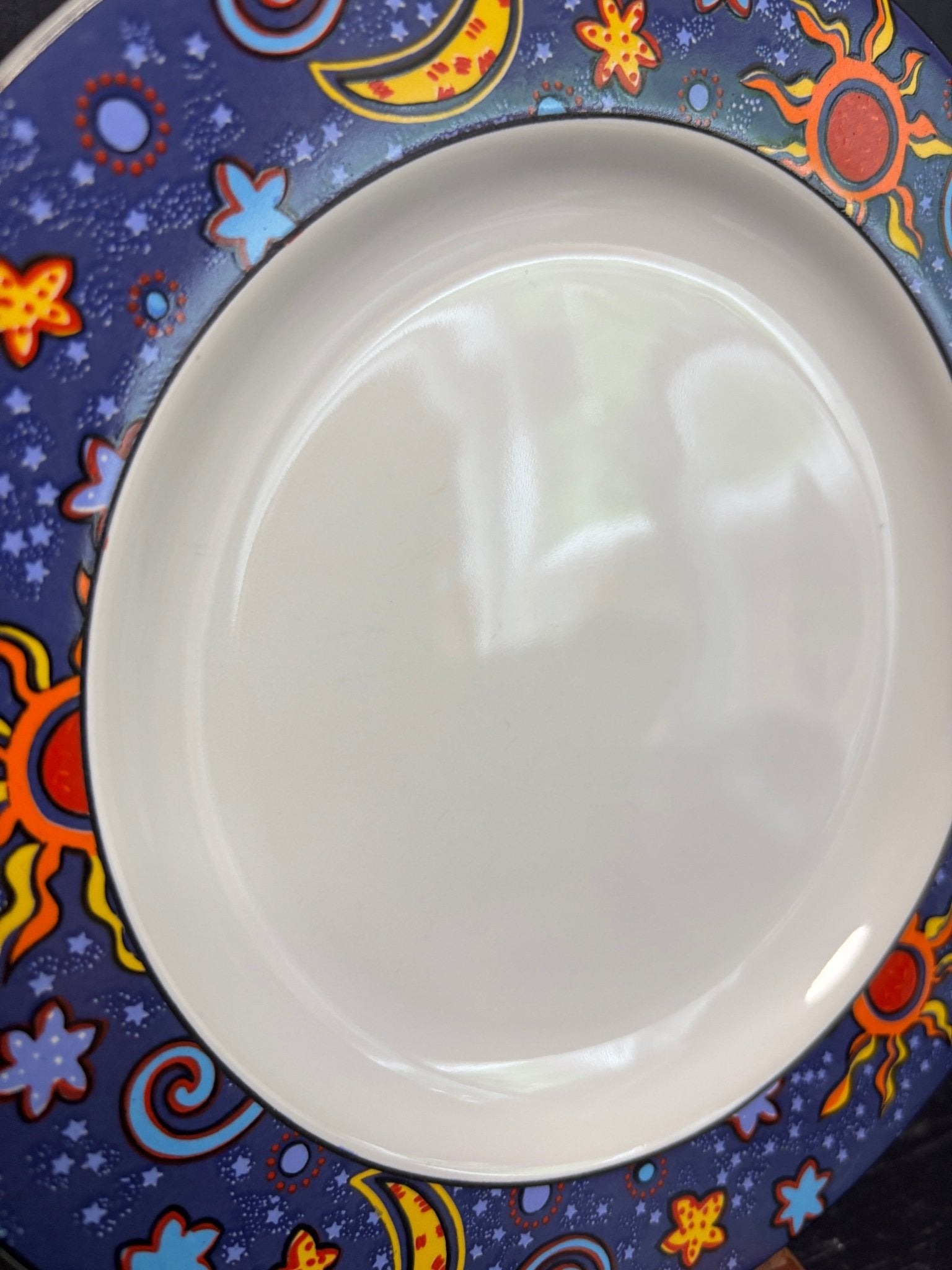 Sakura Celestial Plate with images of stars, moons and suns