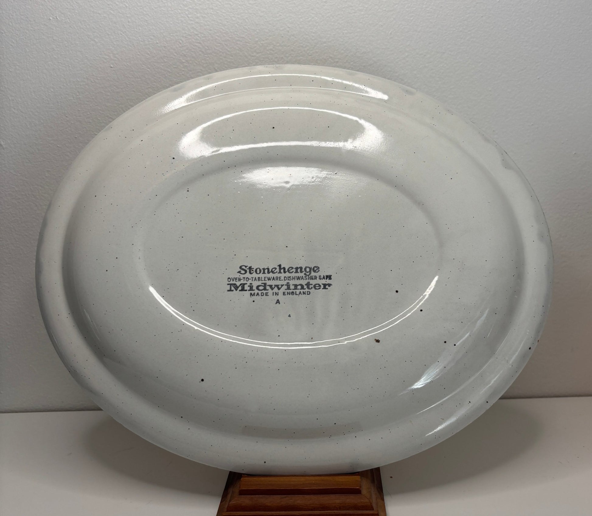 White ceramic platter with 'Stoneshire' branding on a white background