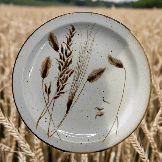 Ceramic plate with wheat design in a field of wheat