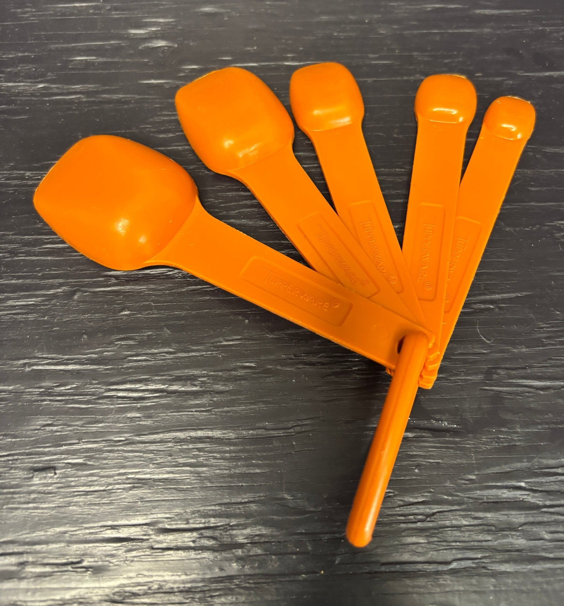 Orange Tupperware Measuring Spoons