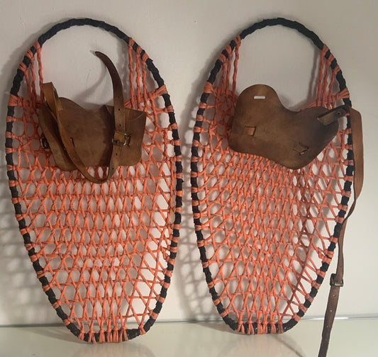 vintage snowshoes with orange wax nylon and leather bindings